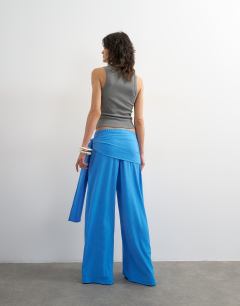 Model wearing Plisse wrap scarf detail trousers in blue