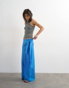 Model wearing Plisse wrap scarf detail trousers in blue