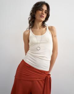 Model wearing Plisse wrap scarf detail trousers in rust