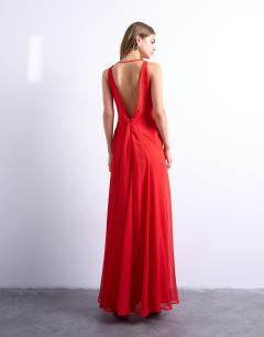 Model wearing Plunge full hem occasion dress with sheer panels in red