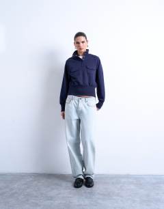 Model wearing Pocket detail funnel neck sweat in navy