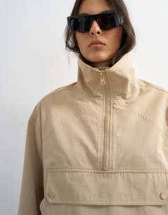 Model wearing Pocket detail zip up jacket in stone