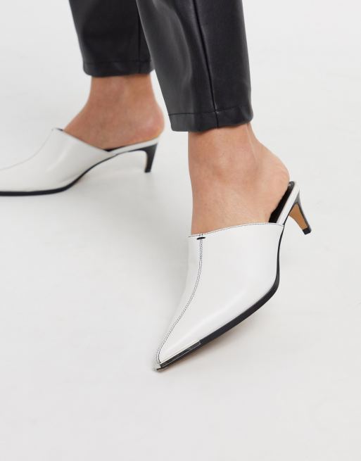 White pointed store toe mules