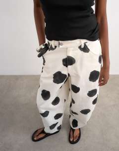 Model wearing Polka dot barrel leg trouser in multi