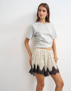 Model wearing Polka dot lace trim shorts in mono