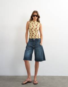 Model wearing Polka dot microfibre fold over tie shoulder top in green