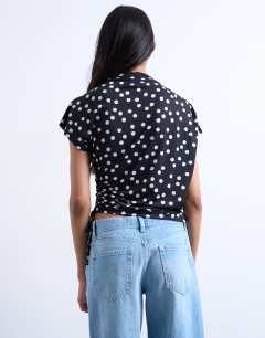 Model wearing Polka dot print asymmetric ruched top in black