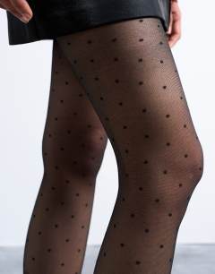 Model wearing Polka dot tights in black