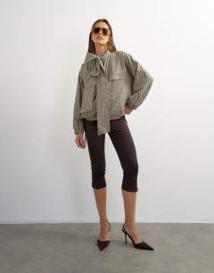 Model wearing Ponte capri leggings in chocolate