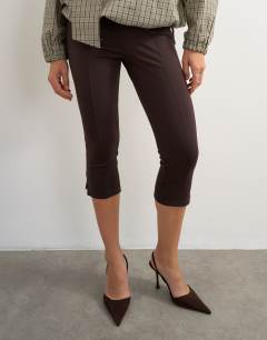 Model wearing Ponte capri leggings in chocolate