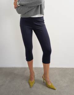 Model wearing Ponte capri leggings in navy