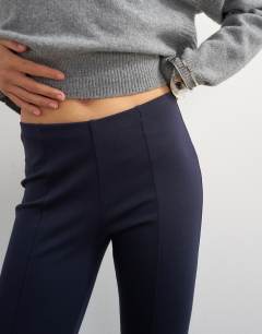 Model wearing Ponte capri leggings in navy