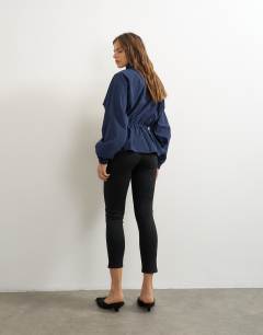 Model wearing Ponte cropped split hem leggings in black
