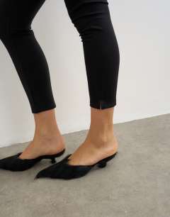 Model wearing Ponte cropped split hem leggings in black
