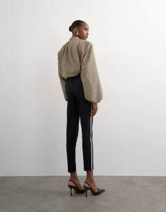 Model wearing Ponte long piping detail leggings in black