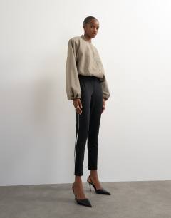 Model wearing Ponte long piping detail leggings in black