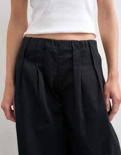 Model wearing Poplin balloon trouser in black