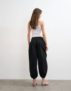 Model wearing Poplin balloon trouser in black