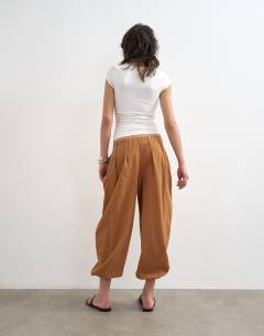 Model wearing Poplin balloon trouser in tan