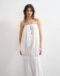 Model wearing Poplin bandeau super dropped waist maxi dress in white