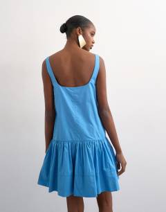 Model wearing Poplin dropped waist square neck mini dress in blue