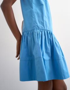 Model wearing Poplin dropped waist square neck mini dress in blue