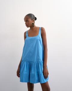 Model wearing Poplin dropped waist square neck mini dress in blue