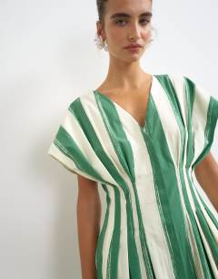 Model wearing Poplin exaggerated shoulder maxi dress with cinched pintuck waist in green and white stripe