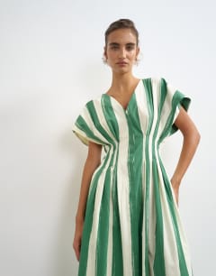 Model wearing Poplin exaggerated shoulder maxi dress with cinched pintuck waist in green and white stripe