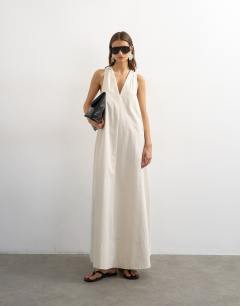 Model wearing Poplin halter deep hem maxi trapeze dress in off white