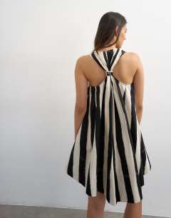 Model wearing Poplin halter deep hem mini trapeze dress in mono stripe