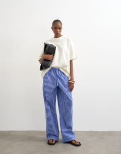 Model wearing Poplin pull on wide leg trouser in dark blue stripe