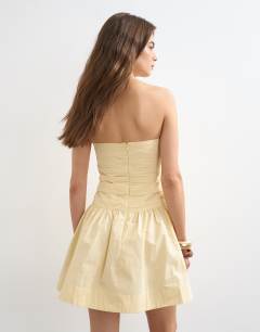 Model wearing Poplin ruched bandeau mini dress in buttermilk