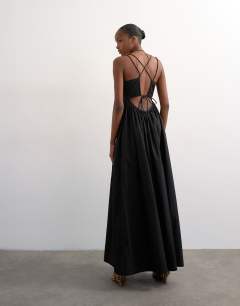 Model wearing Poplin strappy back volume maxi dress in black