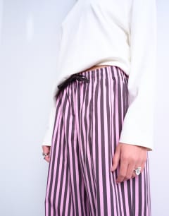 Model wearing Poplin stripe straight leg trouser in pink and purple stripe