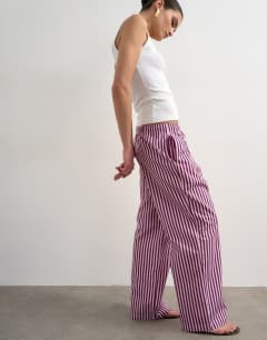 Model wearing Poplin stripe wide leg pull on trouser in pink stripe