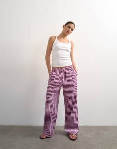 Model wearing Poplin stripe wide leg pull on trouser in pink stripe
