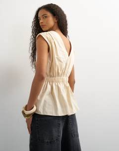 Model wearing Poplin wrap drape detail top in ecru