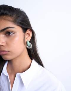 Model wearing Poppi door knocker earring with semi precious stone in silver