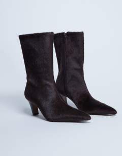 Model wearing Poppy point toe ankle boot in chocolate hair on real leather