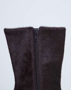 Model wearing Poppy point toe ankle boot in chocolate hair on real leather