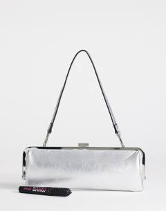 Model wearing Poppy small rectangle clasp shoulder bag in silver