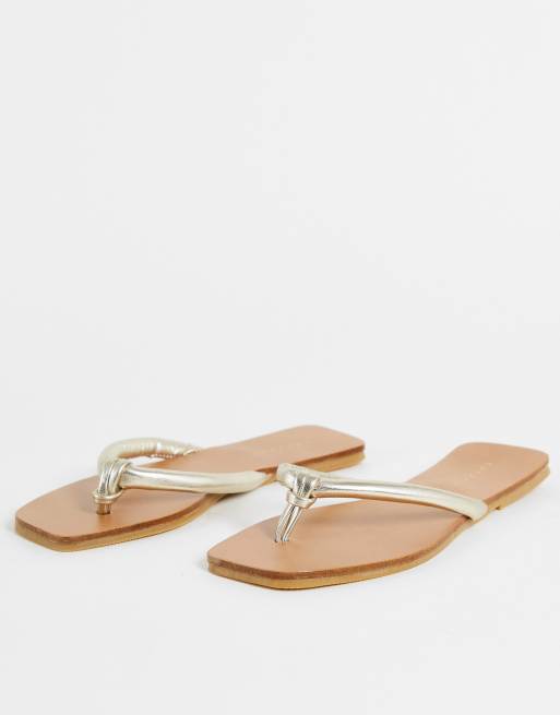 Topshop Poppy tubular flip flops in gold