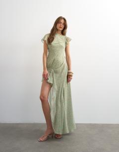 Model wearing Premium chiffon high low maxi dress with smocking detail in green polka dot