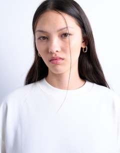 Model wearing Premium clean long sleeve skater tee in white