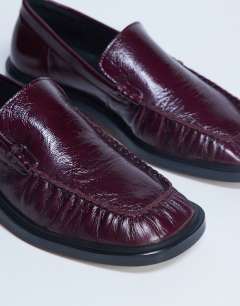 Model wearing Premium Clover real leather loafers with ruched detail in burgundy