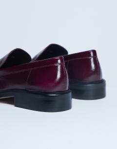 Model wearing Premium Clover real leather loafers with ruched detail in burgundy