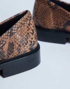 Model wearing Premium Clover real leather loafers with ruched detail in snake print