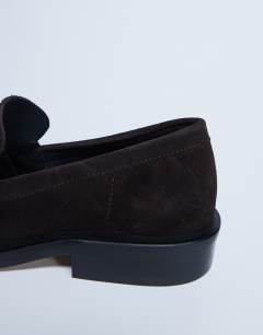 Model wearing Premium Clover real suede loafers with ruched detail in chocolate