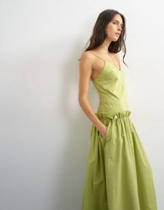 Model wearing Premium cotton maxi dress with raw edge frill detail in green